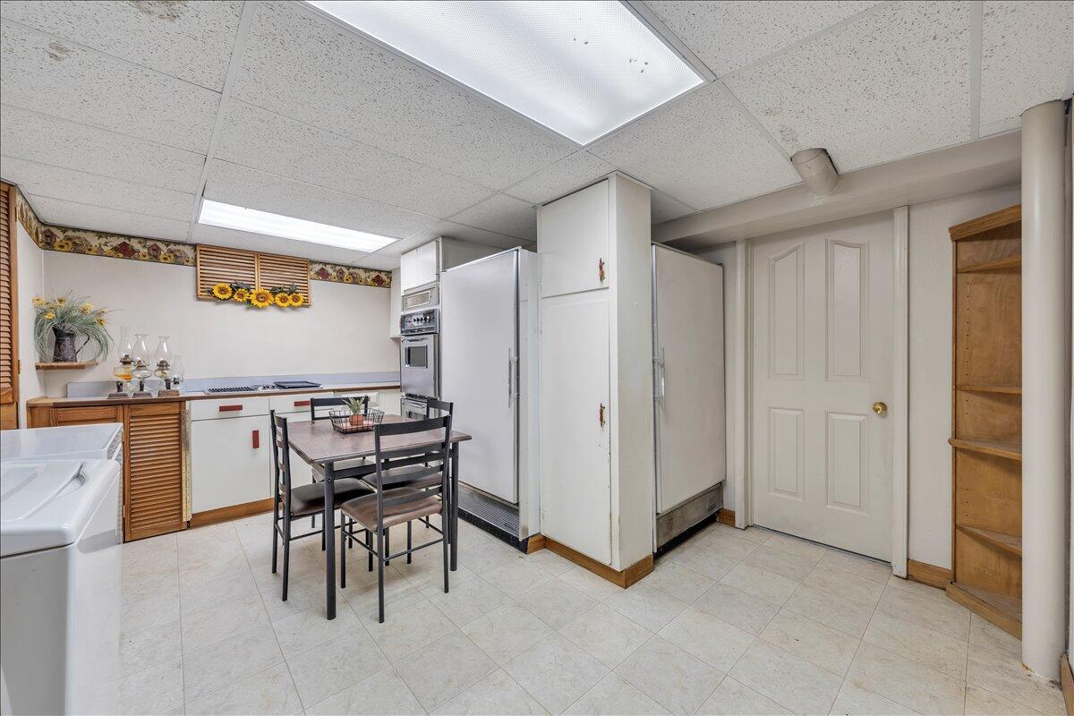 1525 West Ruritan Road Roanoke, VA 24012 - Photo 34 of 62 a kitchen with stainless steel appliances kitchen island granite countertop a refrigerator and a stove top oven