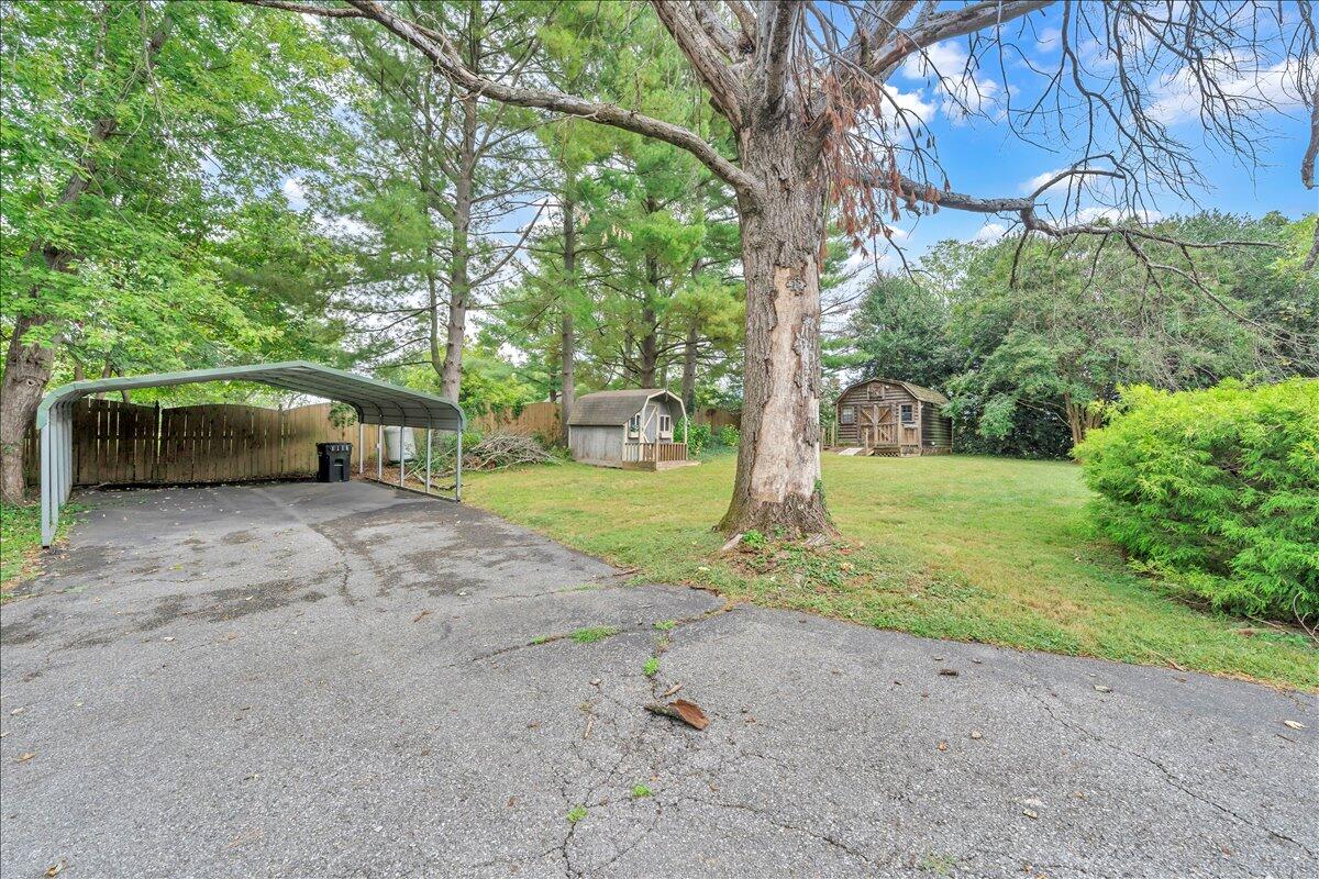 1525 West Ruritan Road Roanoke, VA 24012 - Photo 39 of 62 a view of a house with backyard and a tree