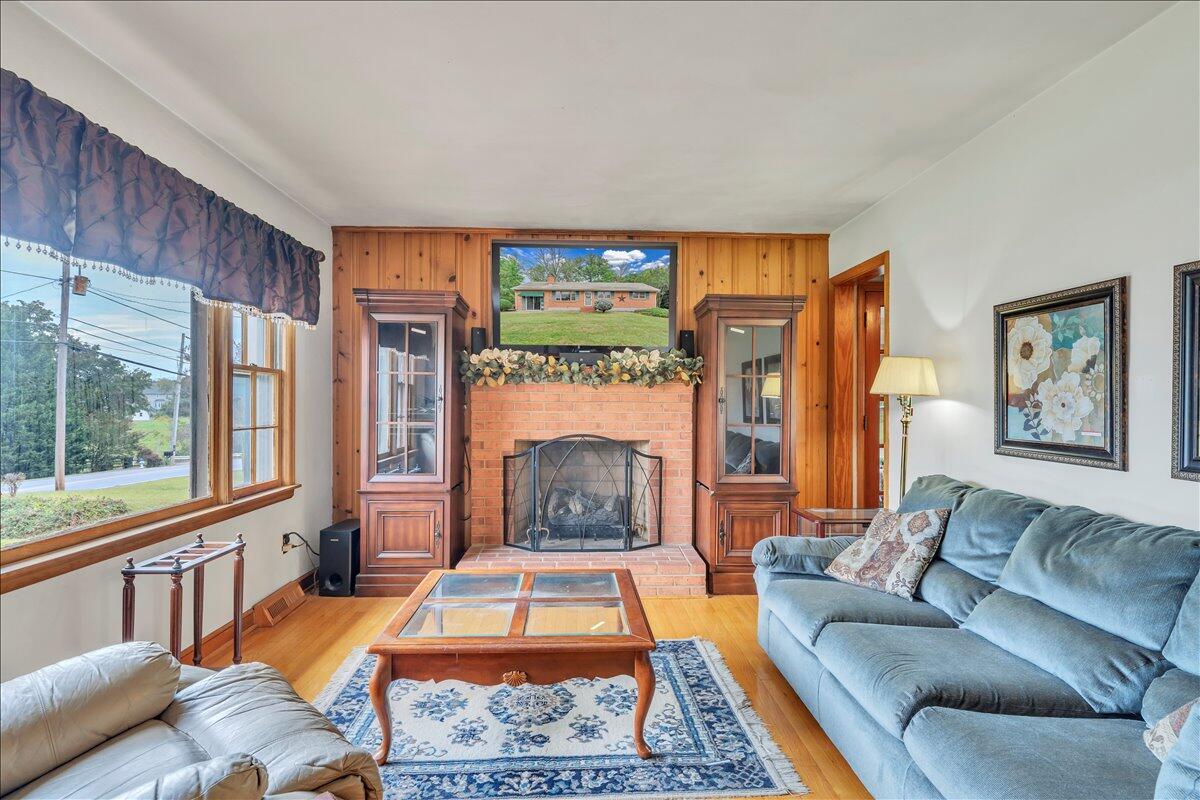 1525 West Ruritan Road Roanoke, VA 24012 - Photo 4 of 62 a living room with furniture fireplace and flat screen tv