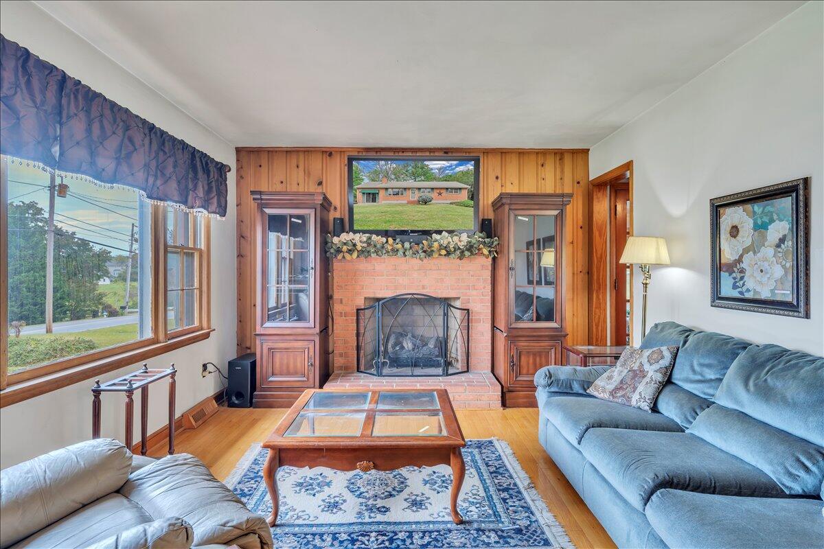 1525 West Ruritan Road Roanoke, VA 24012 - Photo 5 of 62 a living room with furniture fireplace and a large window