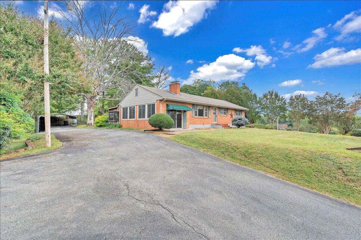 1525 West Ruritan Road Roanoke, VA 24012 - Photo 55 of 62 a view of house with yard and green space
