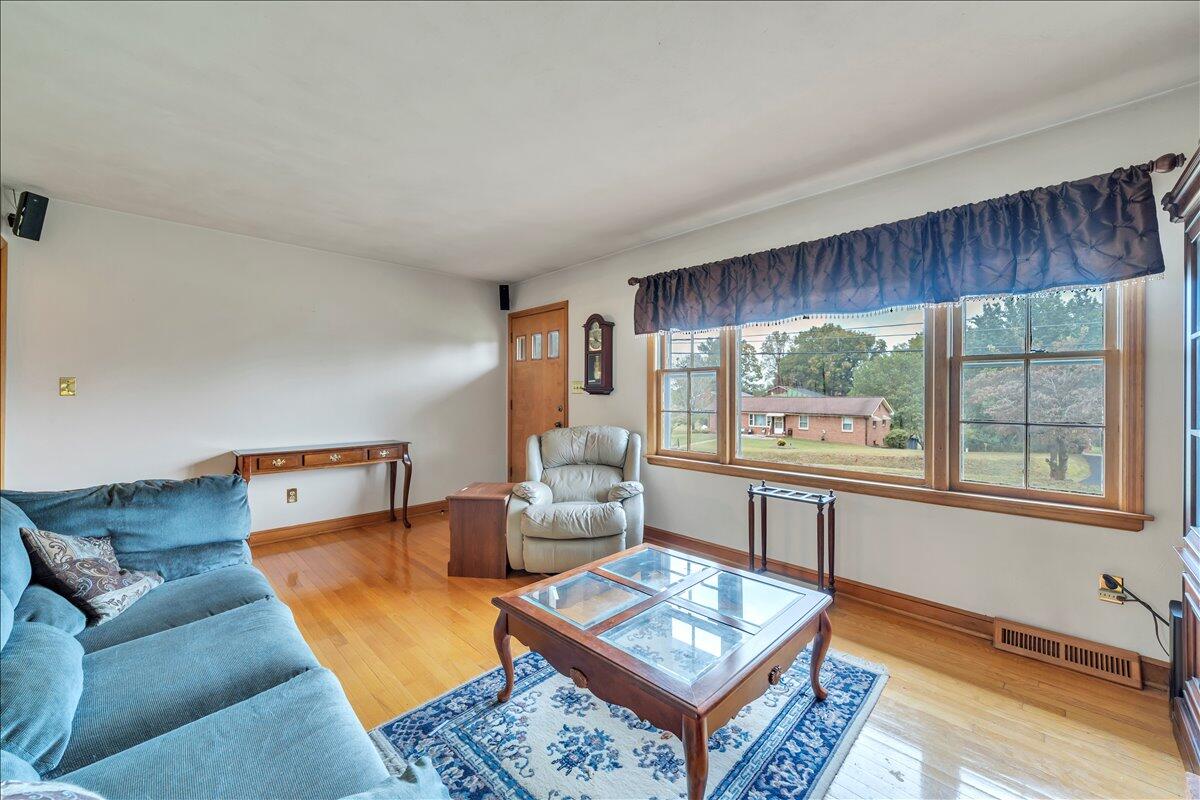 1525 West Ruritan Road Roanoke, VA 24012 - Photo 7 of 62 a living room with furniture and a window