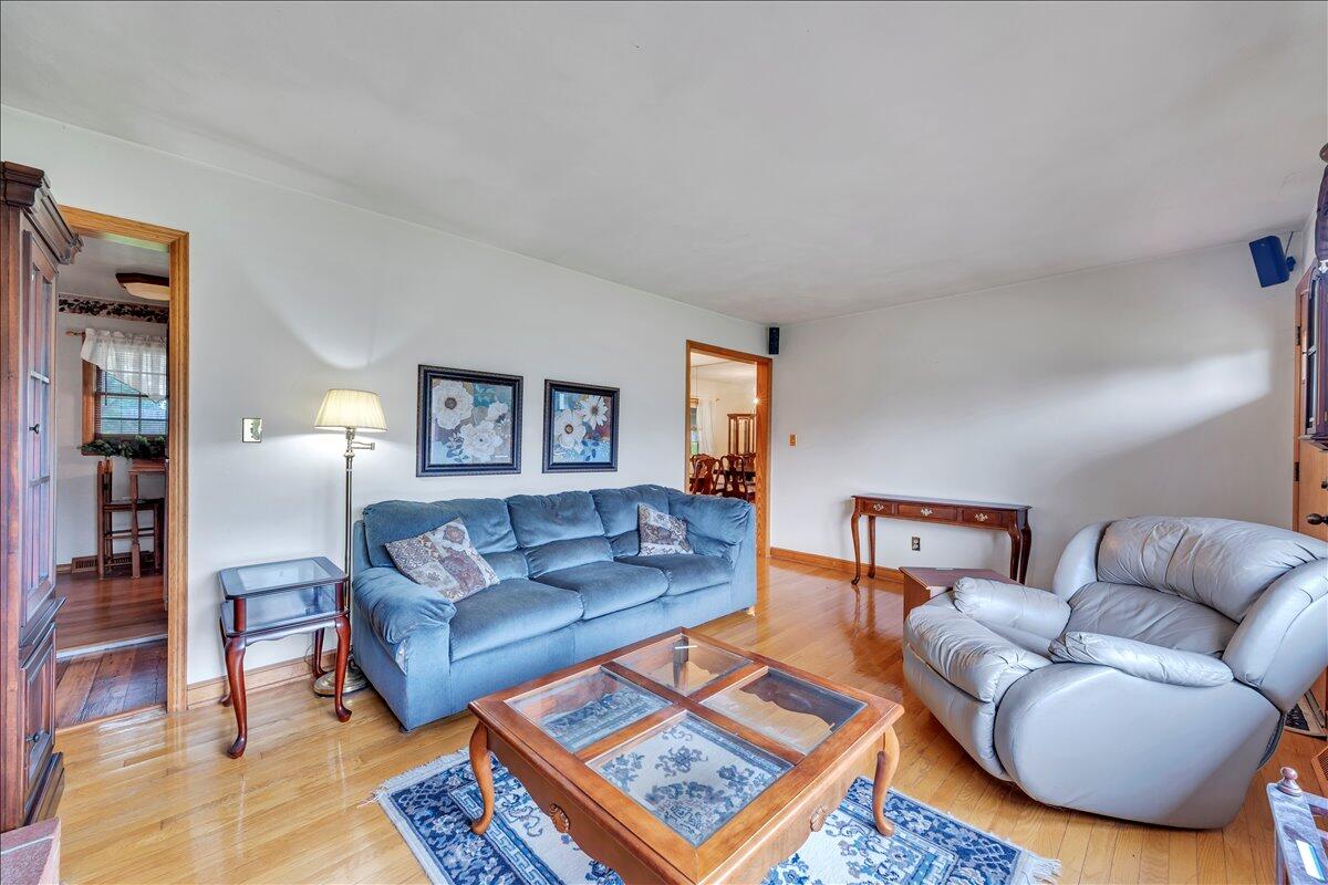 1525 West Ruritan Road Roanoke, VA 24012 - Photo 8 of 62 a living room with furniture a rug and a lamp