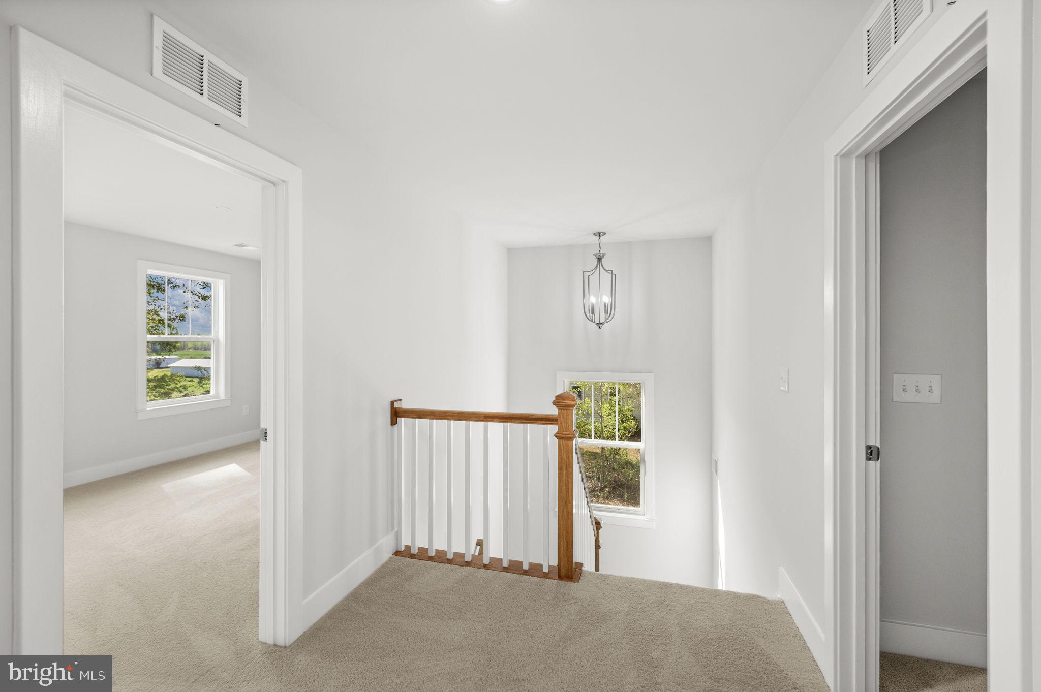 137 Indiantown Road King George, VA 22485 - Photo 18 of 31 Light-filled landing adds openness upstairs