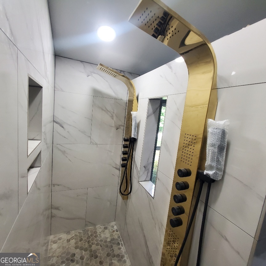 1285 Dallas Highway Villa Rica, GA 30180 - Photo 6 of 9 a bathroom with a shower
