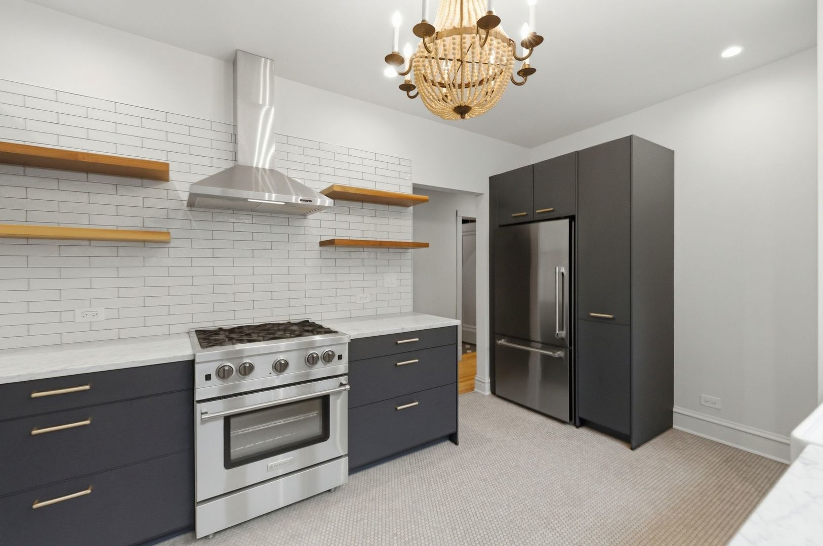 540 Sheridan Road, Unit 3 Evanston, IL 60202 - Photo 14 of 25 a kitchen with a stainless steel appliances granite countertop cabinets and wooden floor