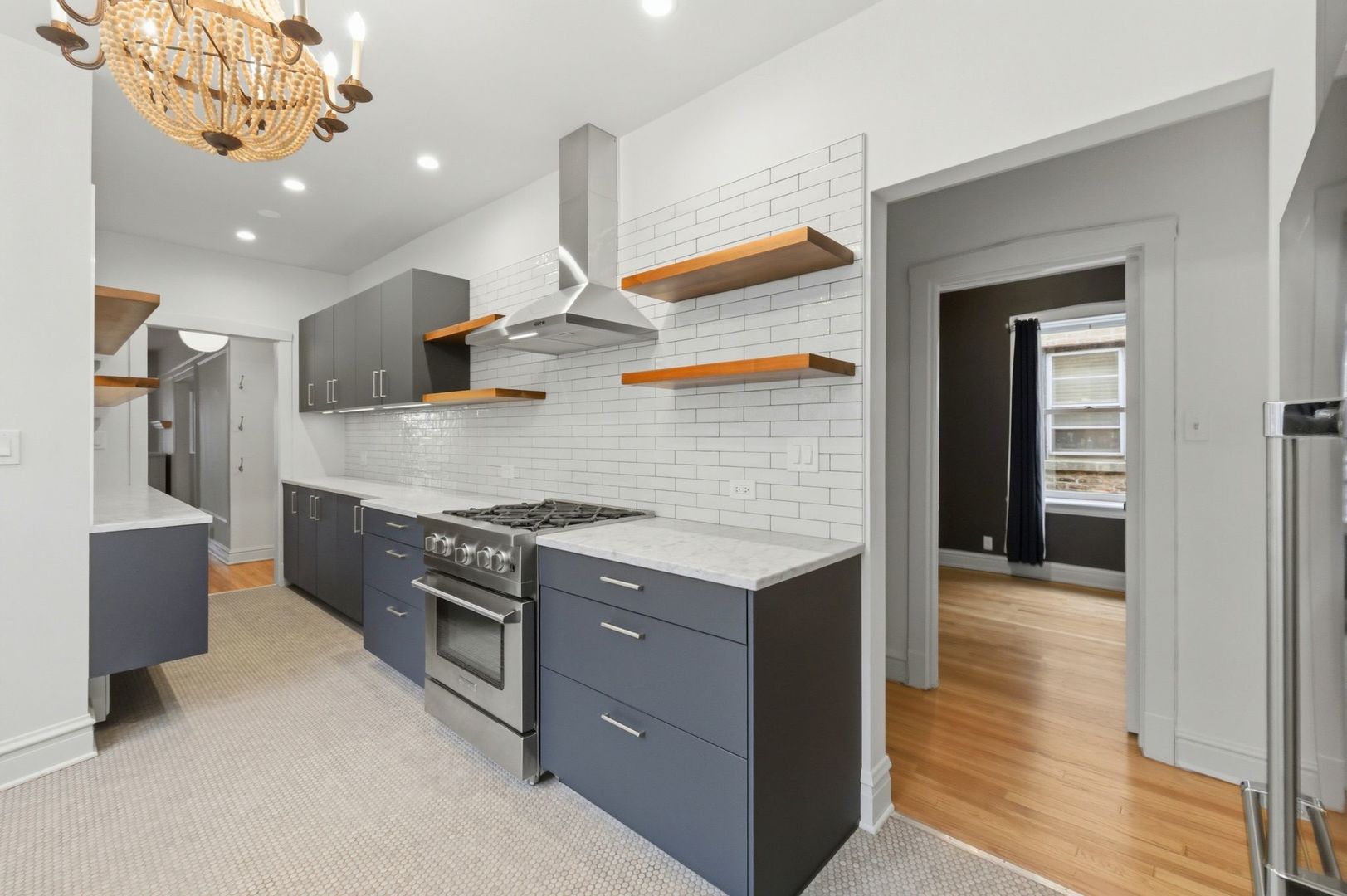 540 Sheridan Road, Unit 3 Evanston, IL 60202 - Photo 15 of 25 a kitchen with stainless steel appliances granite countertop a stove and a refrigerator