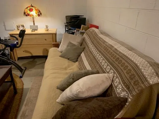 a view of staircase with white walls and a window