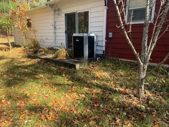 a view of a backyard of the house