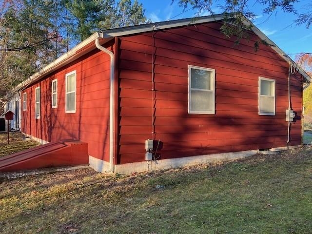 175 Highlands Court Monterey, VA 24465 - Photo 5 of 31 a backyard of a house with wooden fence and large trees