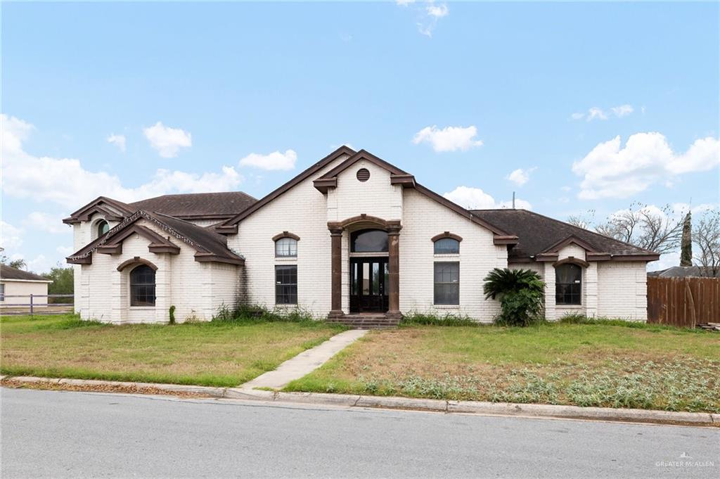 603 Oak Drive Hidalgo, TX 78557 - Photo 1 of 1 French provincial home featuring a front lawn