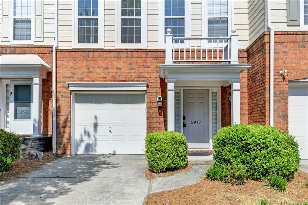 3977 Howell Park Road Duluth, GA 30096 - Photo 2 of 25 front view of a brick house with a large windows