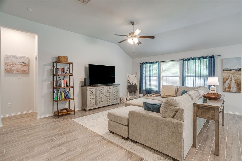 9912 Mescalbean Boulevard Crowley, TX 76036 - Photo 13 of 23 a living room with furniture and a flat screen tv