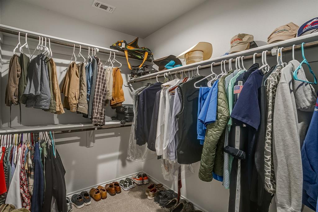 9912 Mescalbean Boulevard Crowley, TX 76036 - Photo 17 of 23 a view of walk in closet with clothes and shoes