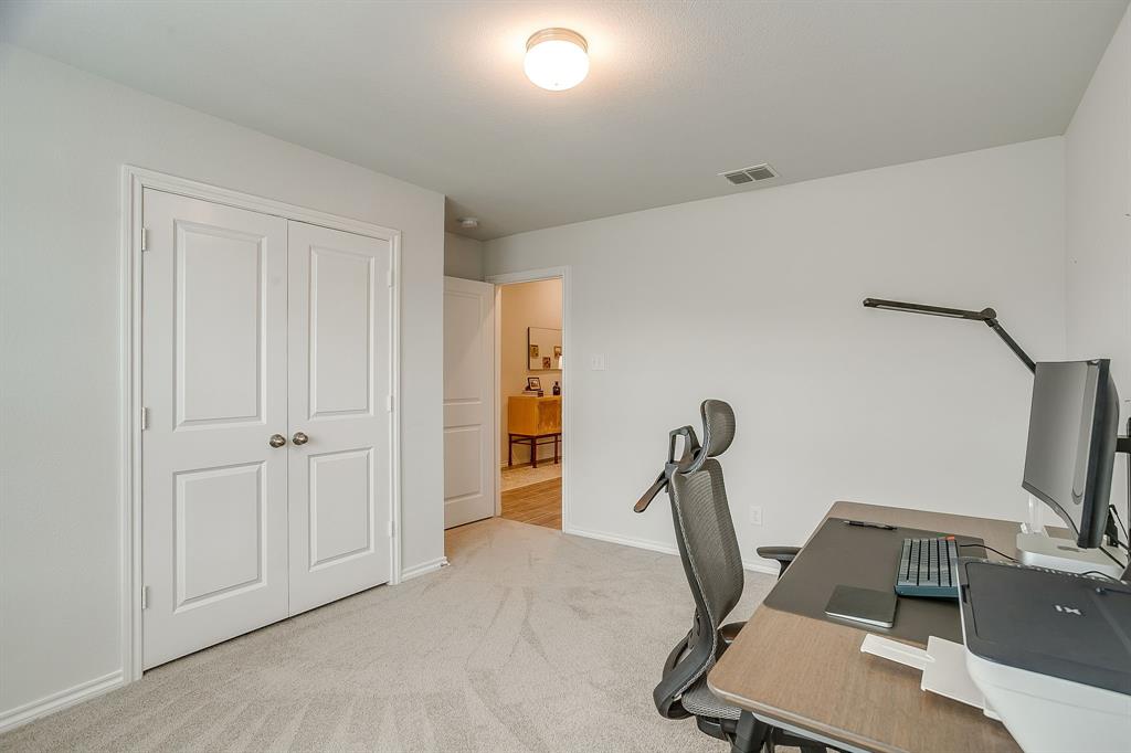 9912 Mescalbean Boulevard Crowley, TX 76036 - Photo 19 of 23 a view of a room with gym equipment