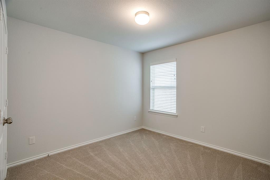 9912 Mescalbean Boulevard Crowley, TX 76036 - Photo 20 of 23 an empty room with windows