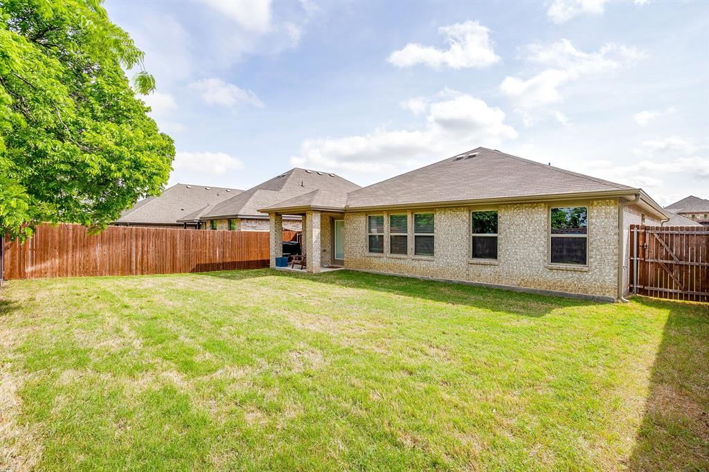 9912 Mescalbean Boulevard Crowley, TX 76036 - Photo 22 of 23 a front view of a house with yard