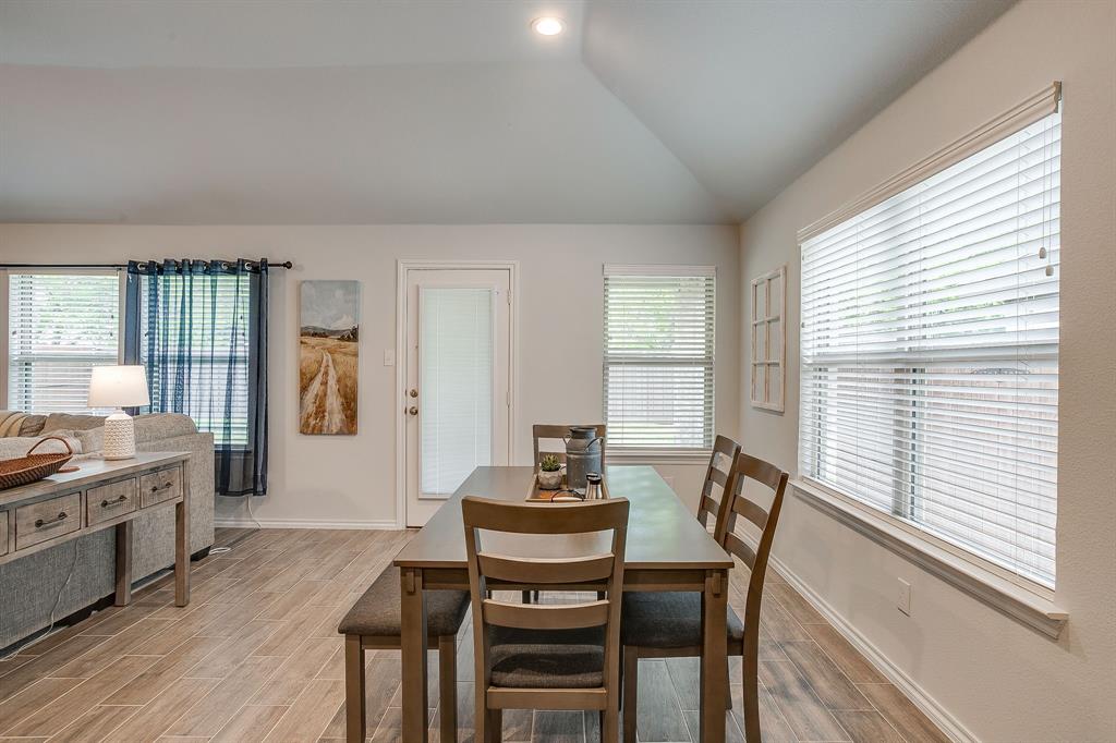 9912 Mescalbean Boulevard Crowley, TX 76036 - Photo 5 of 23 a view of a dining room with furniture and windows