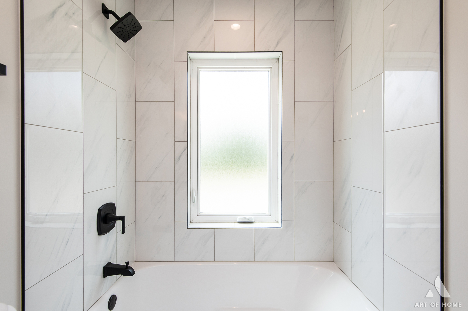 7957 West 73rd Place Bridgeview, IL 60455 - Photo 33 of 40 a bathroom with a window bathtub and shower