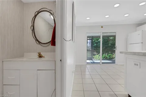 a bathroom with a sink a mirror and a shower