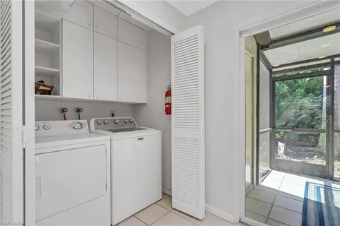 a view of storage and utility room with washer and dryer