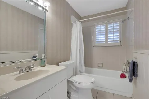 a bathroom with a sink toilet and tub