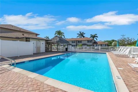 a view of a swimming pool with a lounge chair