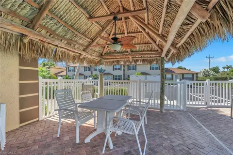 a view of a chairs and table in a patio