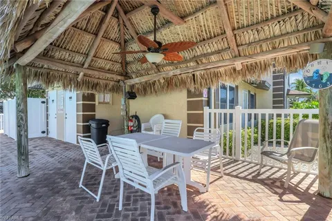 a view of a chairs and table in the patio