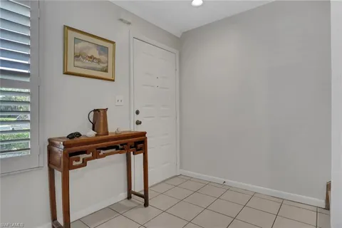 a view of a hallway with front door