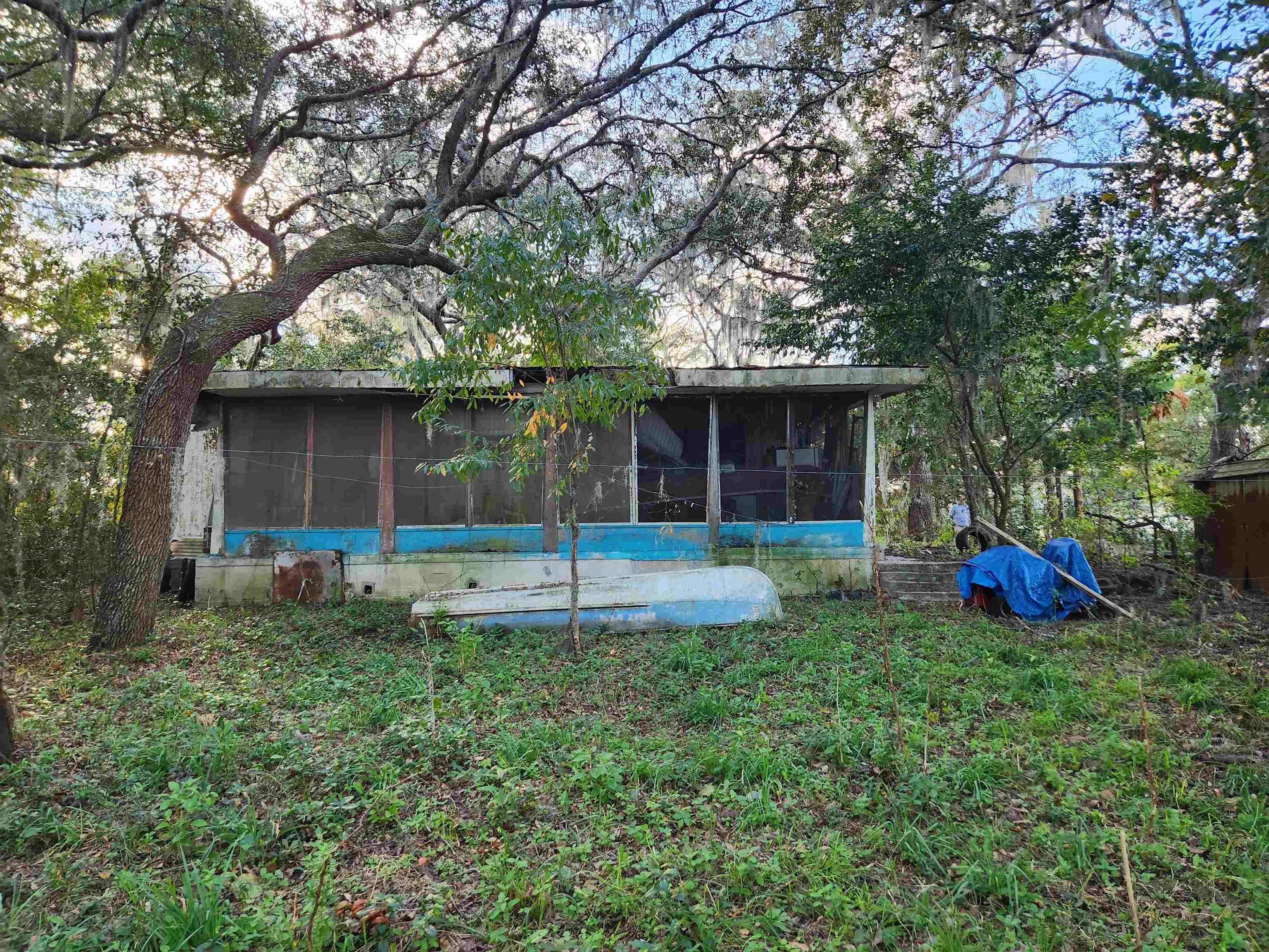 2890 Old Moultrie Road St. Augustine, FL 32086 - Photo 14 of 18 a view of a house with a yard and sitting area