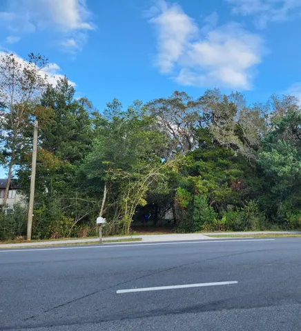 a view of a yard from a balcony