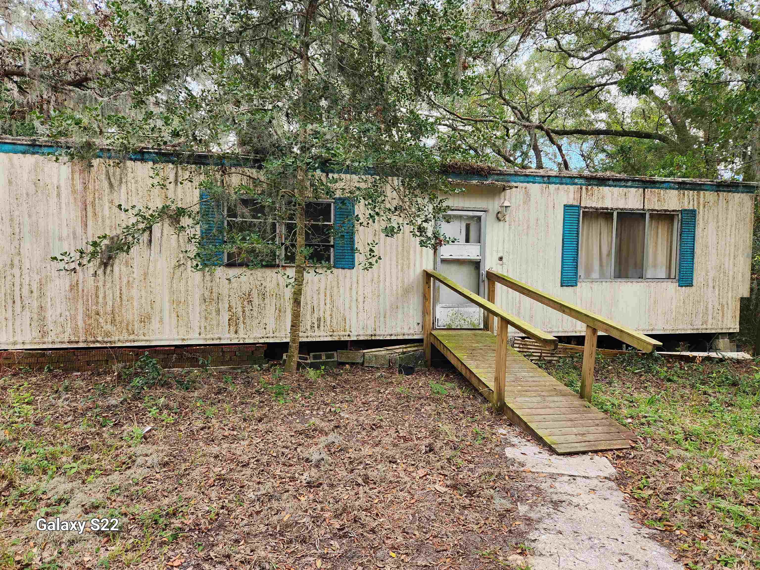 2890 Old Moultrie Road St. Augustine, FL 32086 - Photo 4 of 18 a view of a house with wooden fence