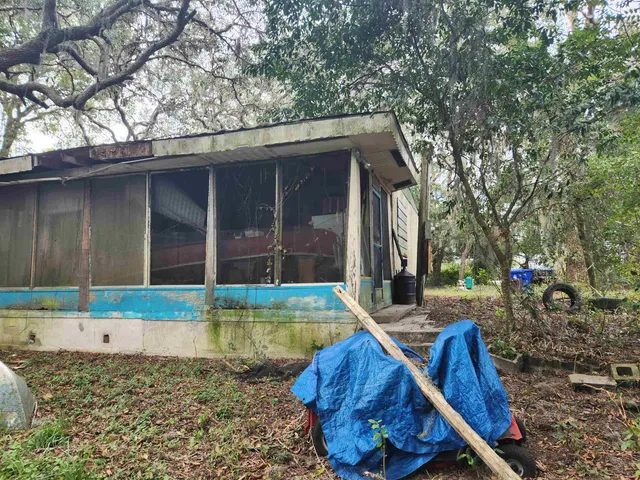 a backyard of a house with seating space