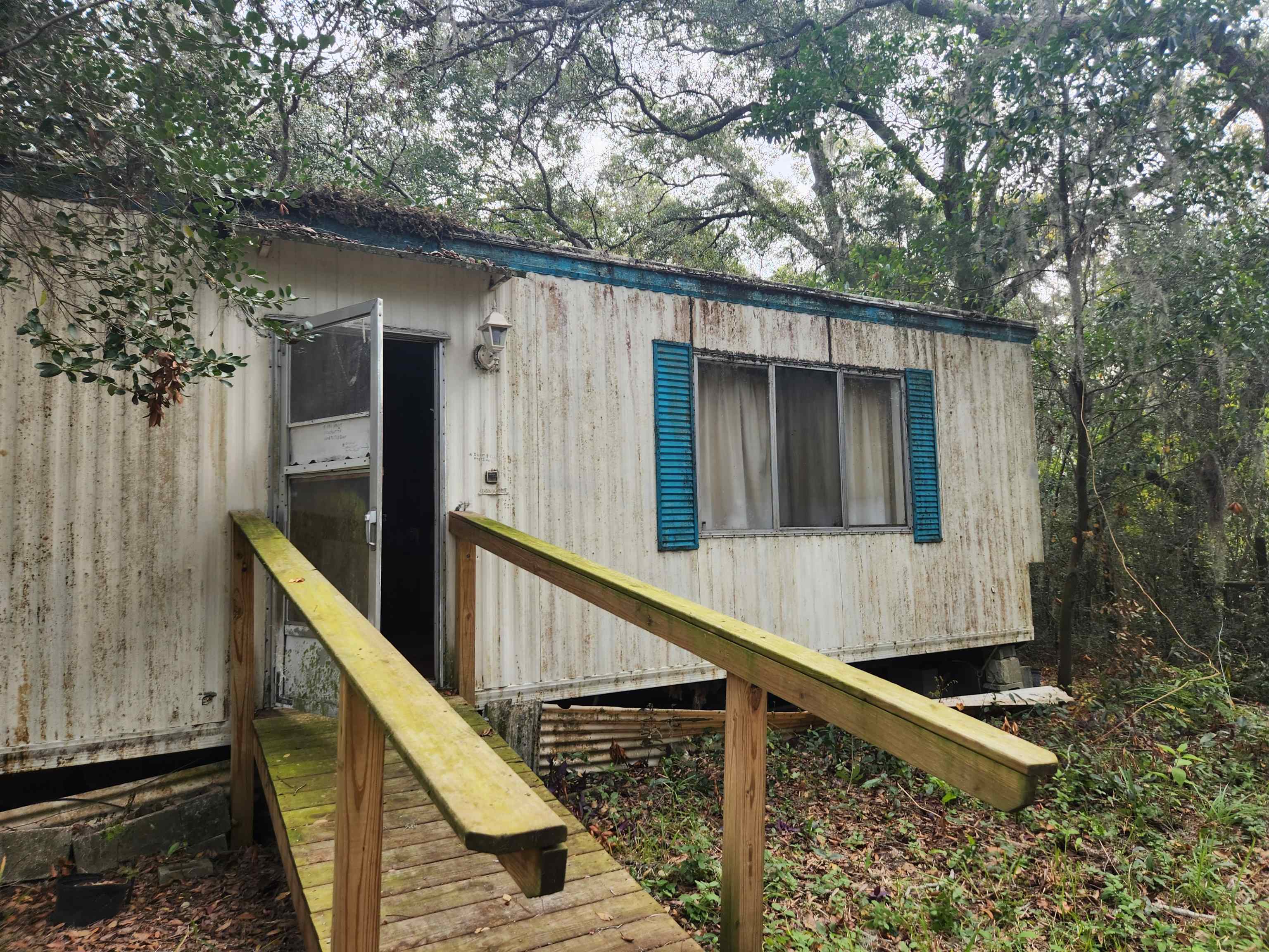 2890 Old Moultrie Road St. Augustine, FL 32086 - Photo 9 of 18 a view of balcony with wooden floor and fence