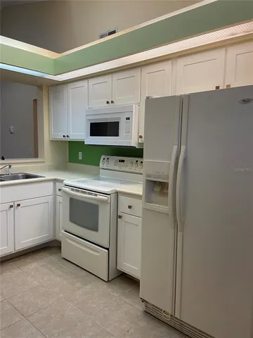 a view of a hallway with front door