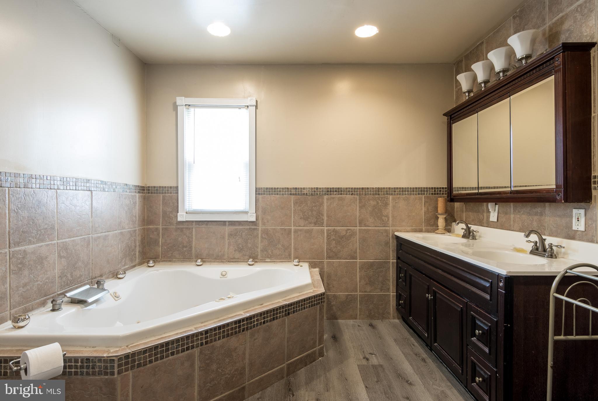 3629 Forest Hill Road Baltimore, MD 21207 - Photo 24 of 39 The main level bath is beyond deluxe with jacuzzi.