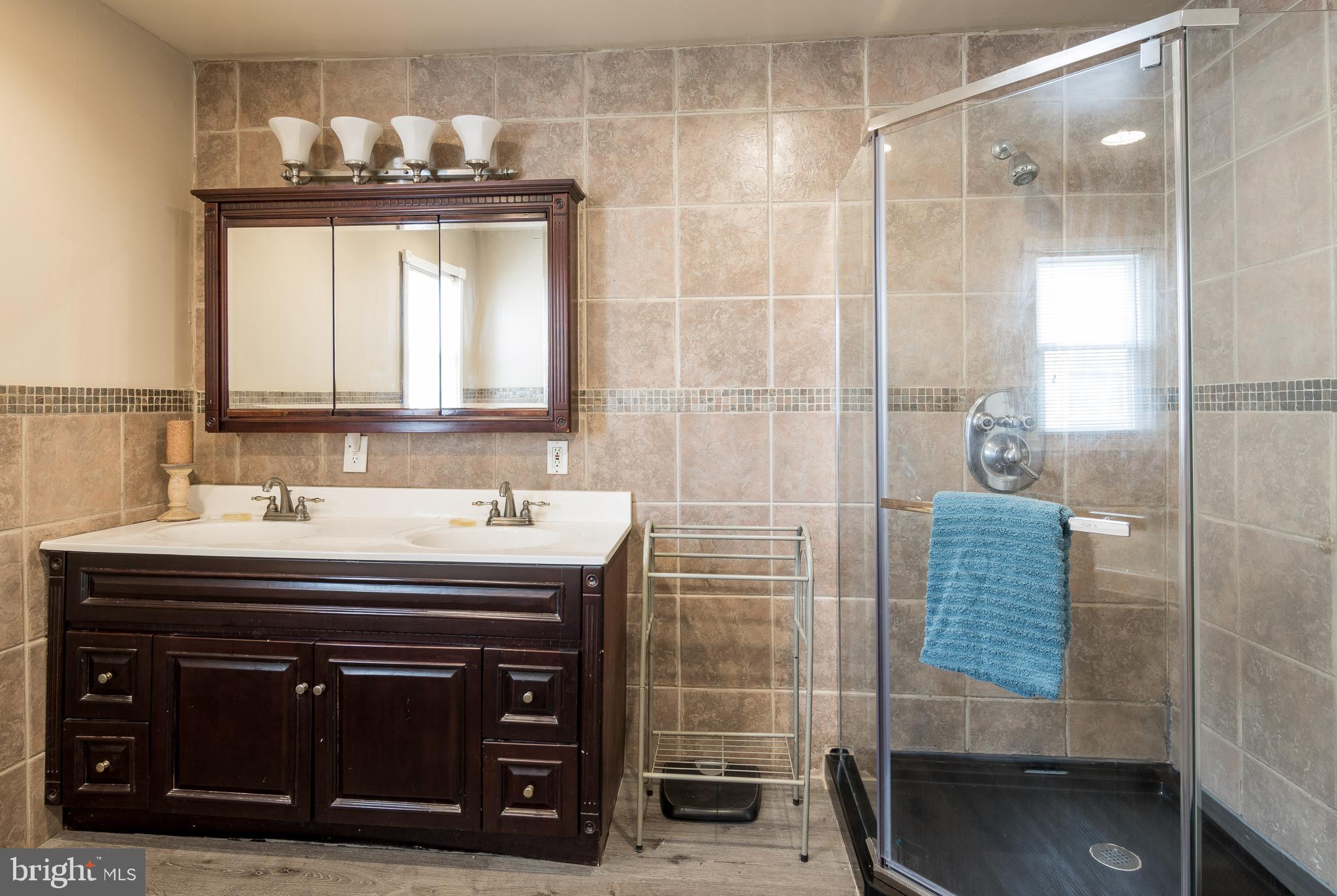 3629 Forest Hill Road Baltimore, MD 21207 - Photo 25 of 39 A double vanity and a separate shower.