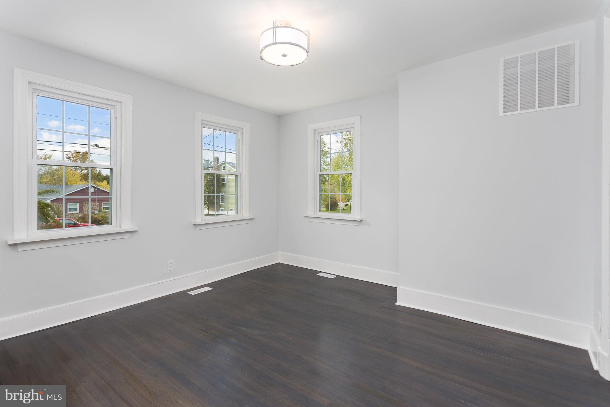 36 Chest-Georgetown Road Columbus, NJ 08022 - Photo 11 of 60 a view of an empty room with wooden floor and a window