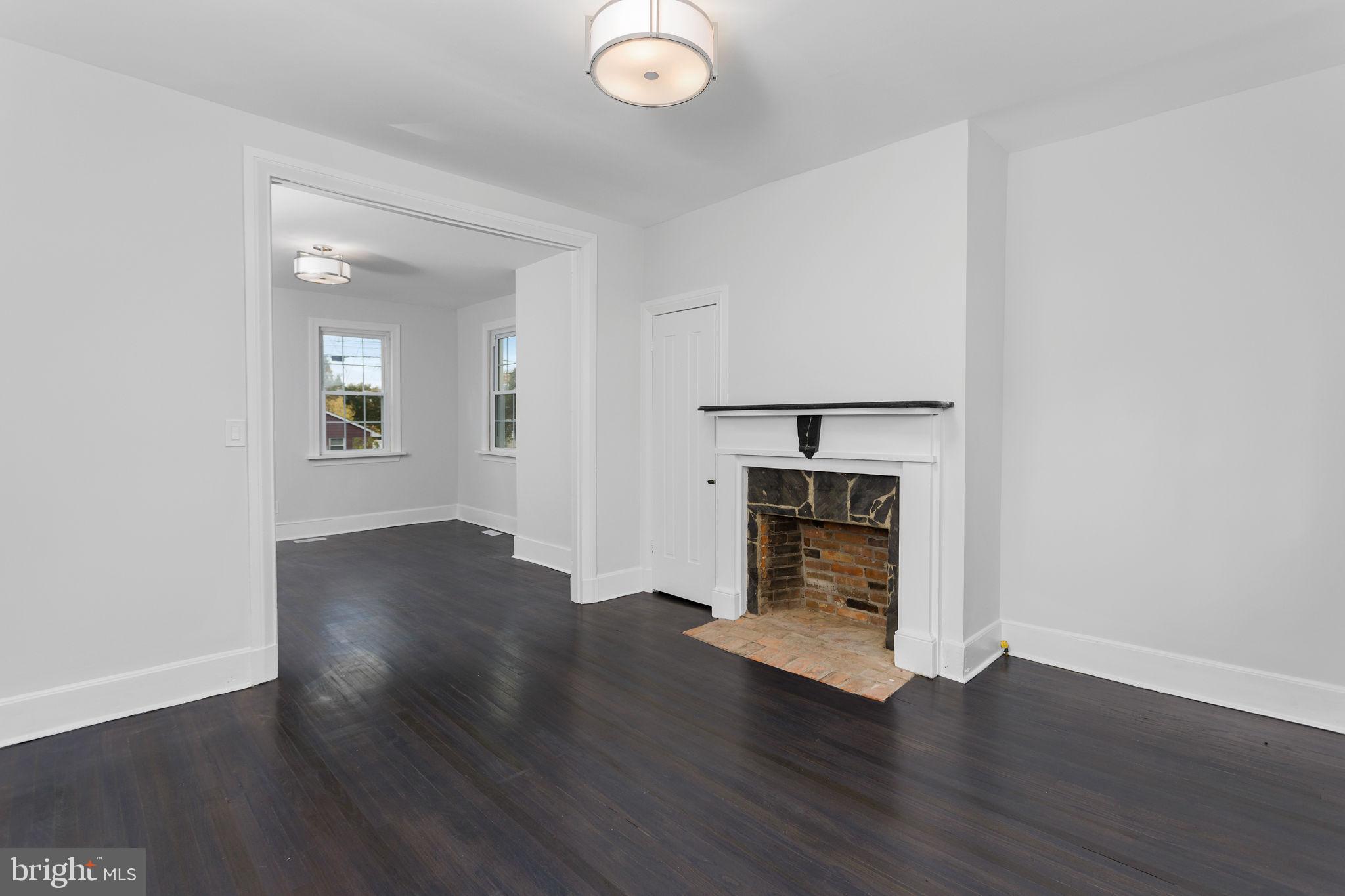 36 Chest-Georgetown Road Columbus, NJ 08022 - Photo 16 of 60 an empty room with wooden floor fire place and windows