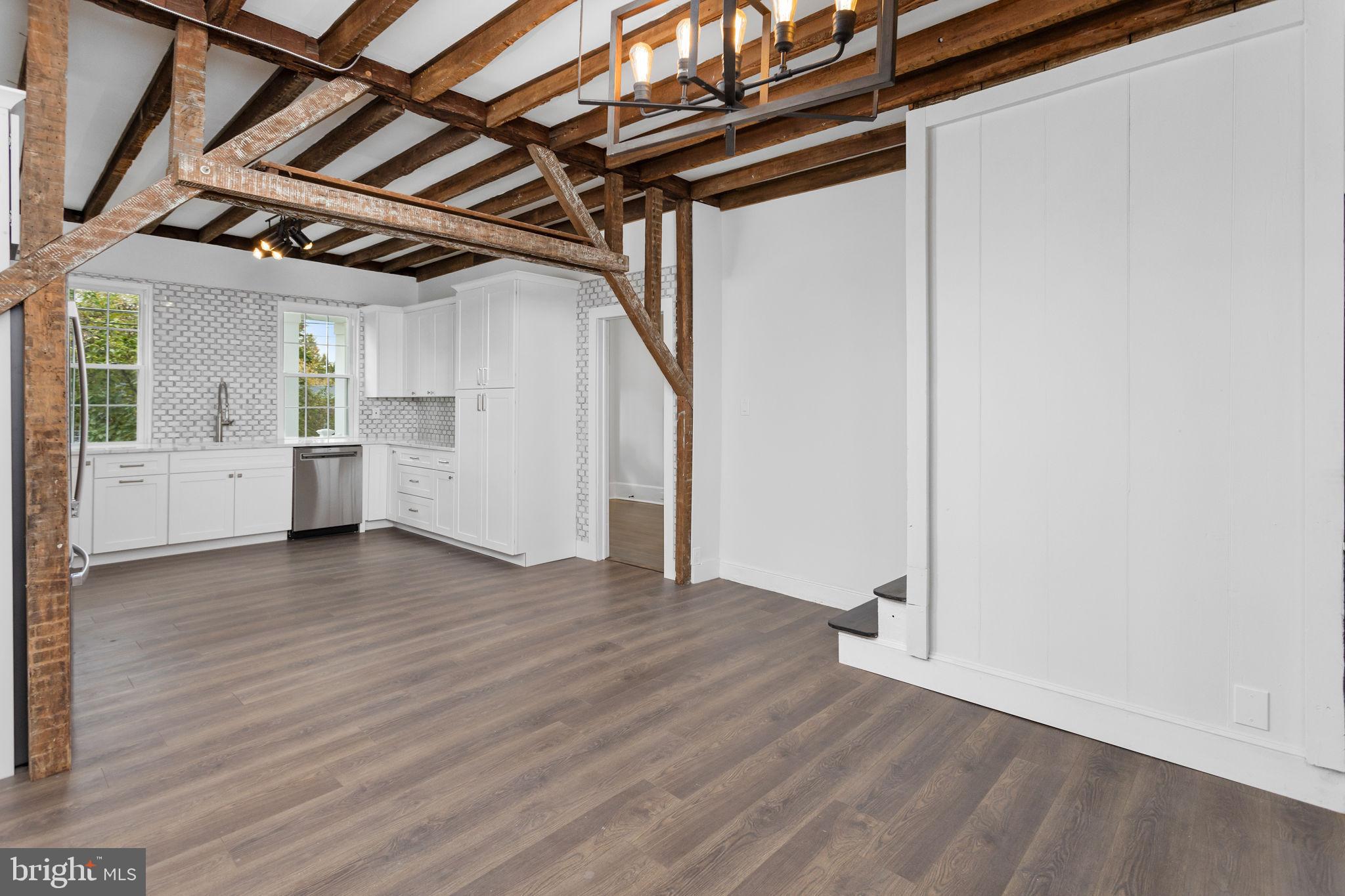 36 Chest-Georgetown Road Columbus, NJ 08022 - Photo 21 of 60 a view of empty room with wooden floor and windows