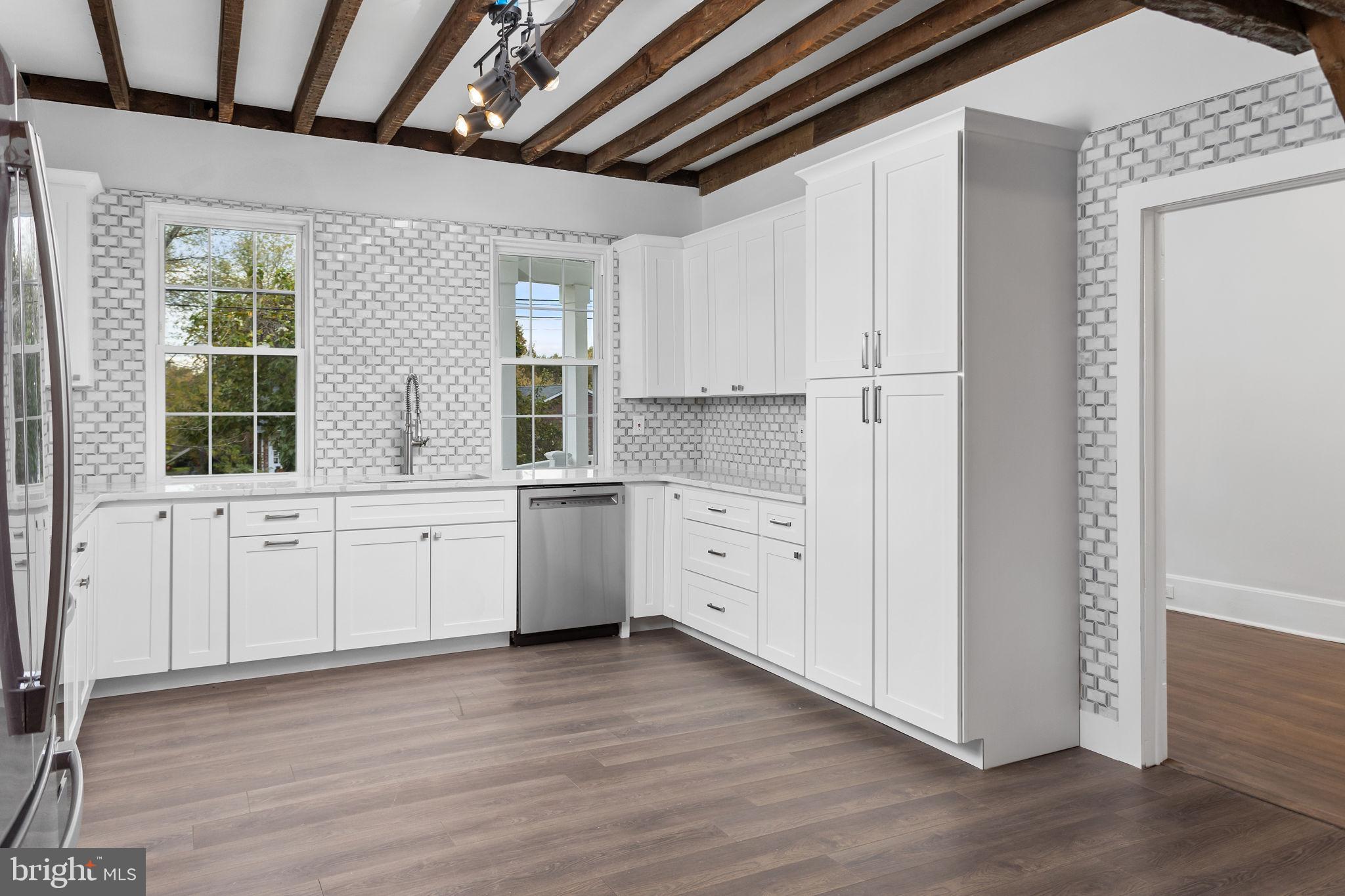36 Chest-Georgetown Road Columbus, NJ 08022 - Photo 23 of 60 a kitchen with granite countertop white cabinets and white appliances