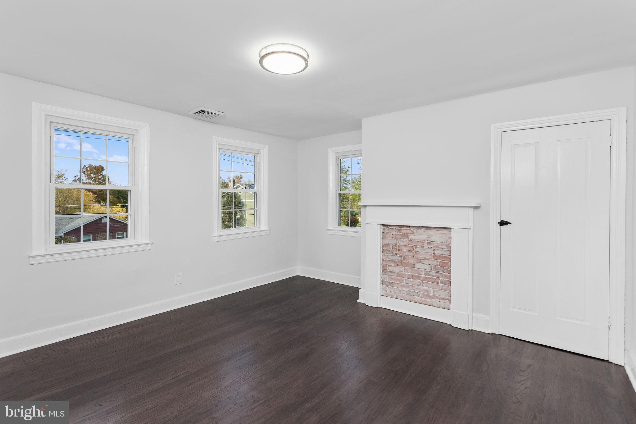 36 Chest-Georgetown Road Columbus, NJ 08022 - Photo 37 of 60 an empty room with wooden floor cabinet and windows