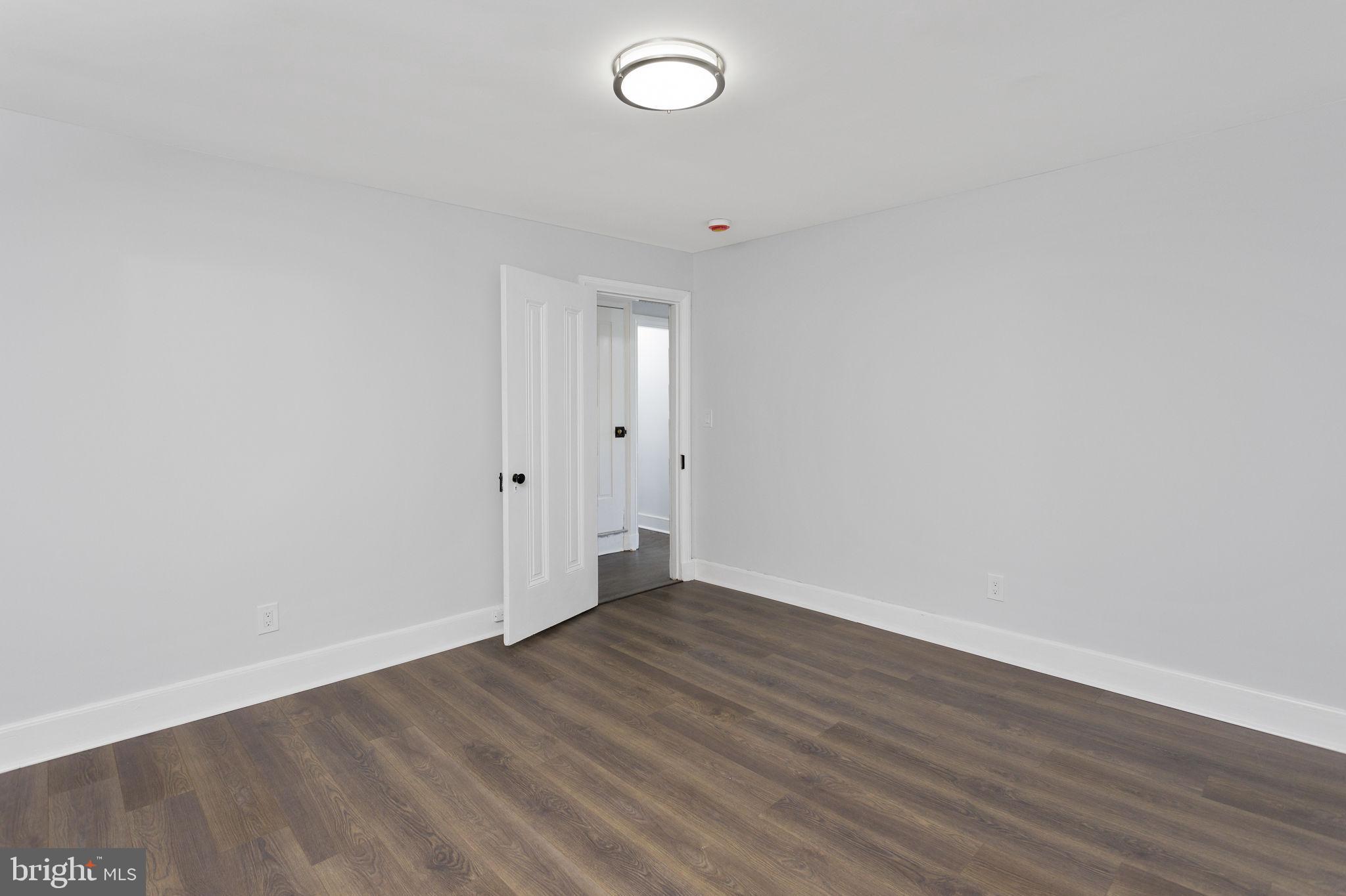 36 Chest-Georgetown Road Columbus, NJ 08022 - Photo 44 of 60 a view of an empty room with wooden floor and a window