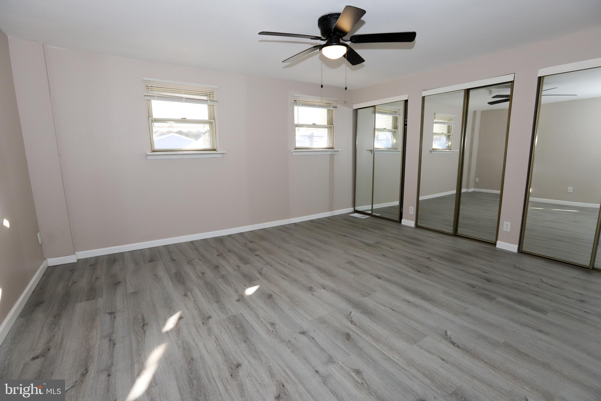 3559 Churchill Lane Philadelphia, PA 19114 - Photo 15 of 30 a view of empty room with wooden floor and window