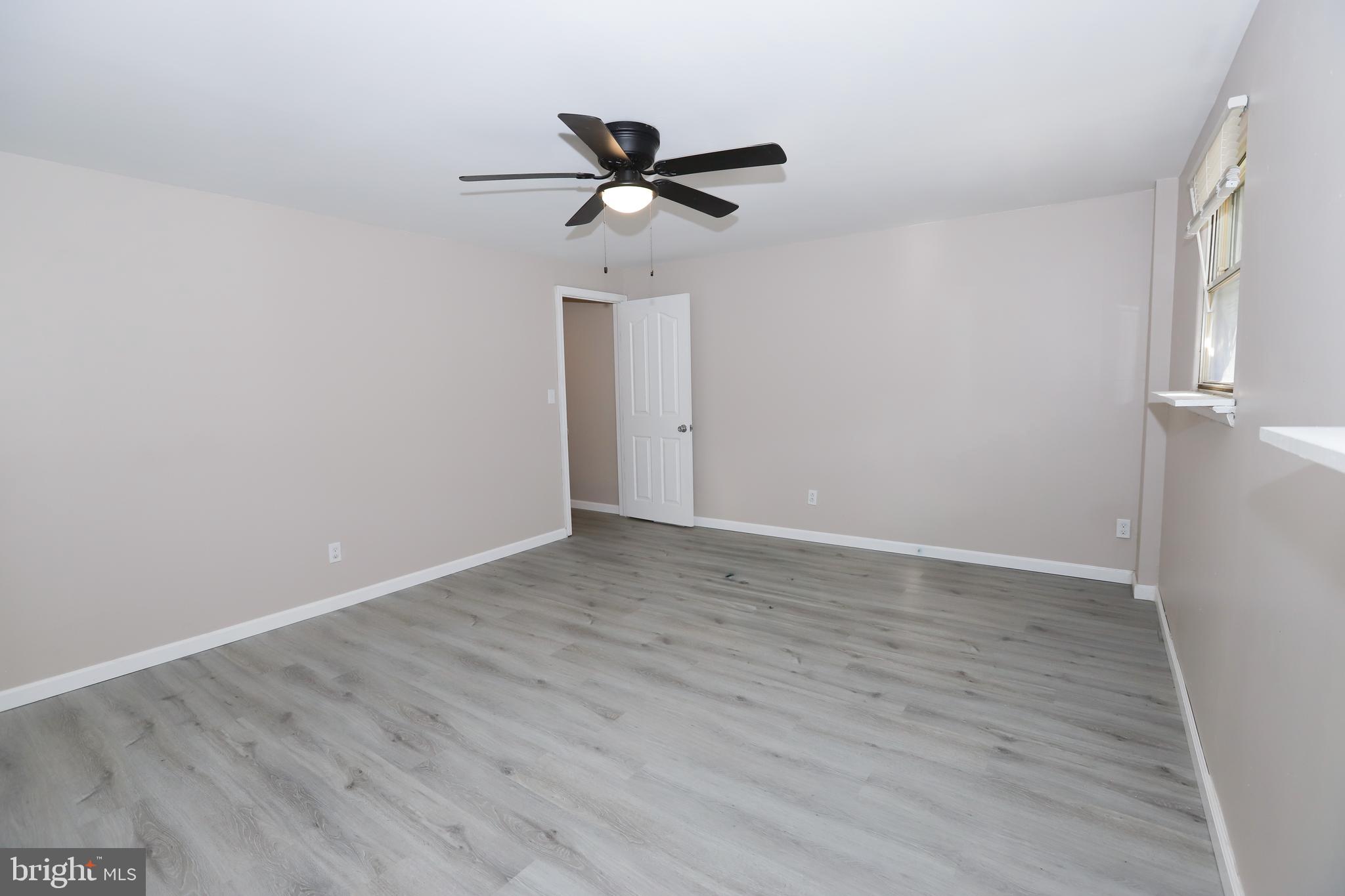3559 Churchill Lane Philadelphia, PA 19114 - Photo 16 of 30 a view of an empty room with wooden floor
