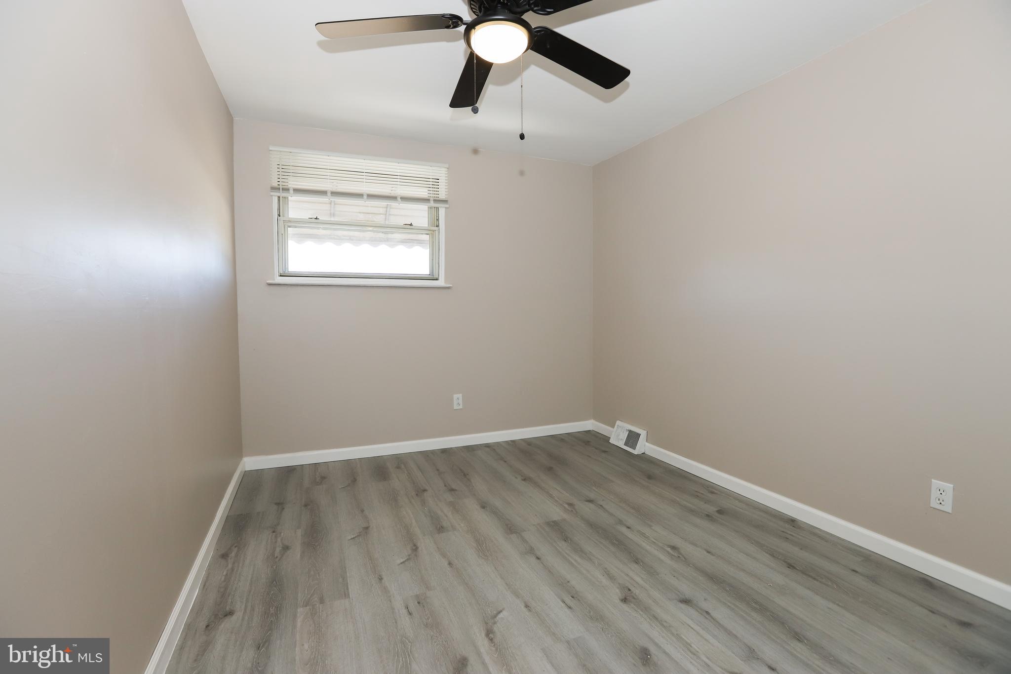 3559 Churchill Lane Philadelphia, PA 19114 - Photo 22 of 30 an empty room with a window and a fan