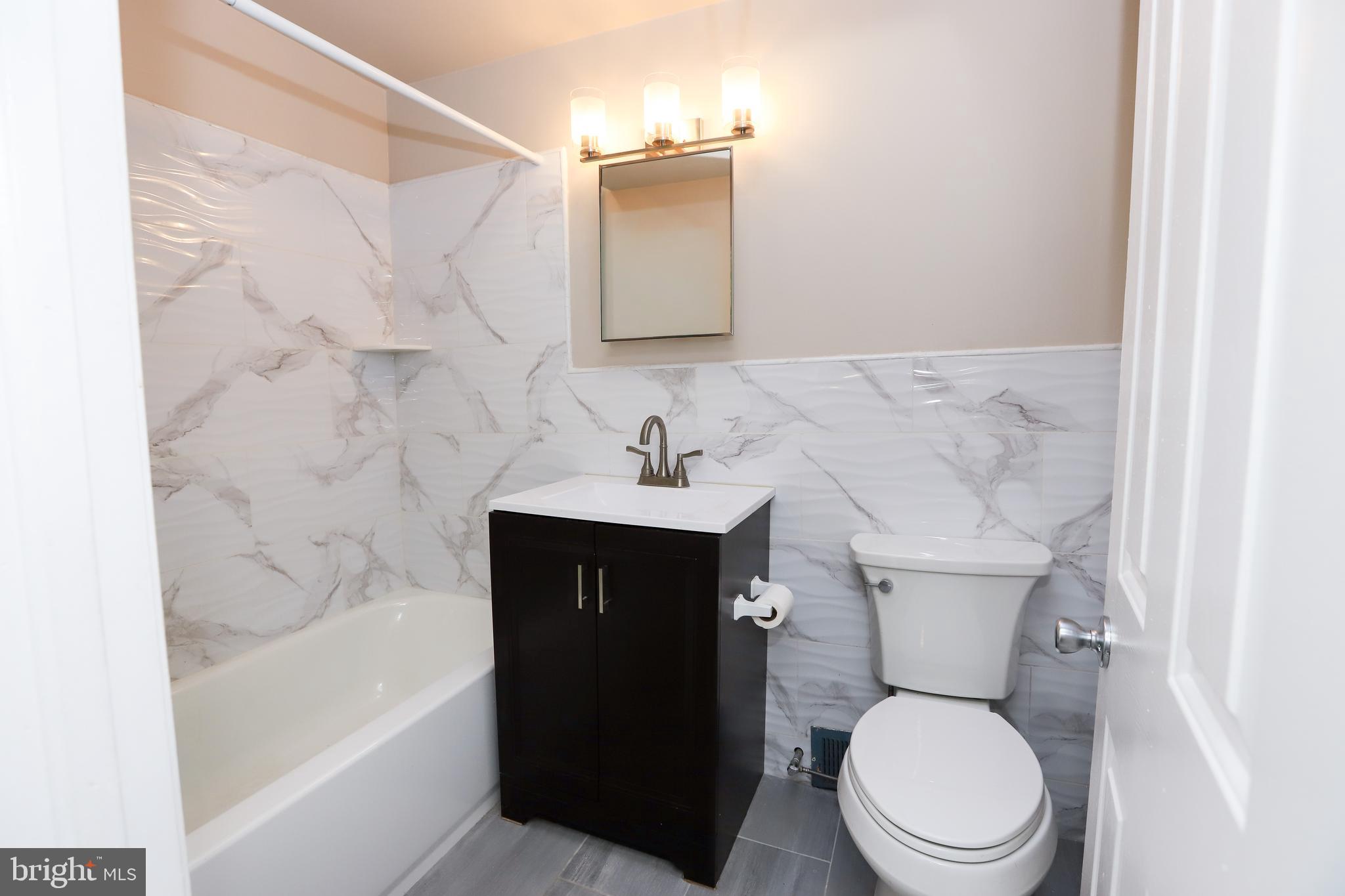 3559 Churchill Lane Philadelphia, PA 19114 - Photo 23 of 30 a bathroom with a sink toilet and shower