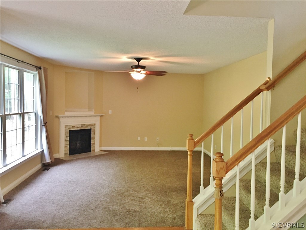 7212 Swiftrock Ridge Terrace Chesterfield, VA 23838 - Photo 5 of 17 Great room with fireplace that is open to the kitc