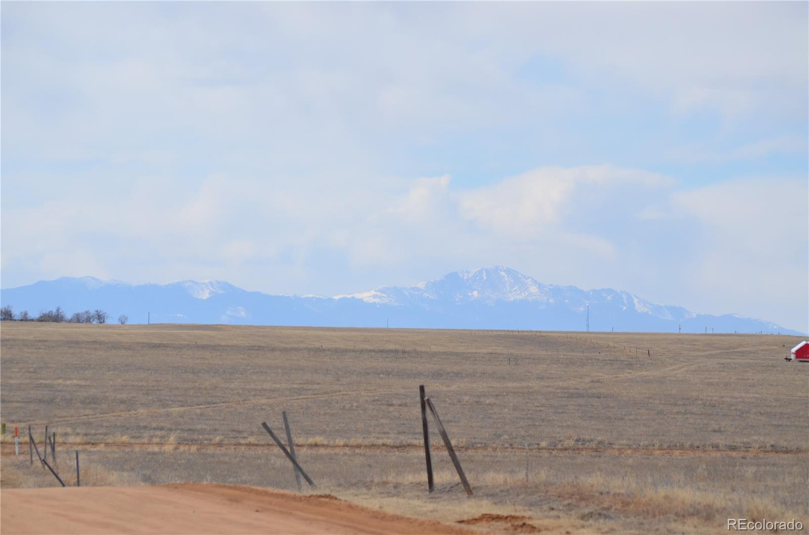 2 County Road South Rush, CO 80833 - Photo 1 of 12 a view of an lake and a mountain